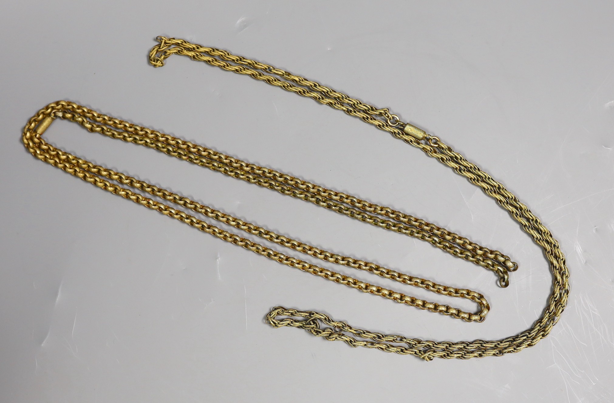 Two 19th century pinchbeck guard chains, longest 118 cm(a.f.)